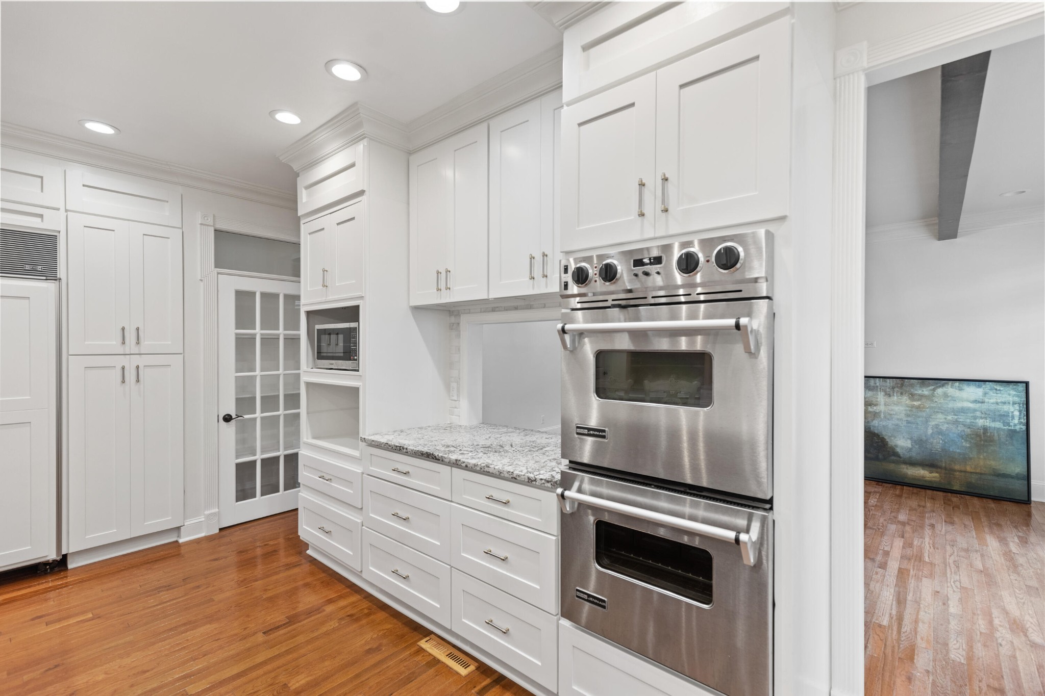 8421 Pedigo Road Powell, TN 37849 - Photo 11 of 57 a kitchen with granite countertop white cabinets and stainless steel appliances