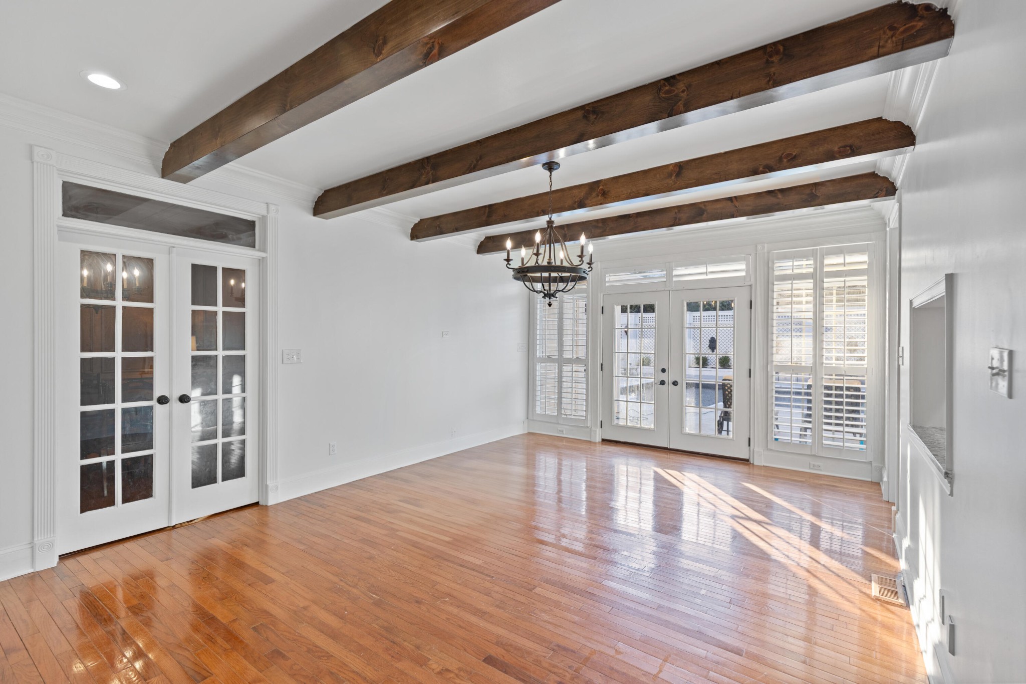 8421 Pedigo Road Powell, TN 37849 - Photo 14 of 57 a view of an empty room with wooden floor and windows