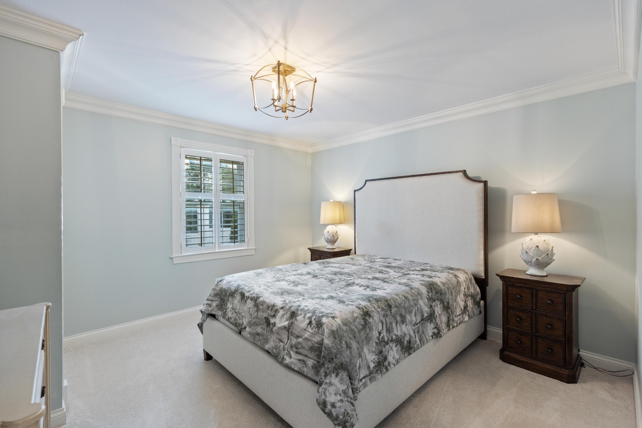 8421 Pedigo Road Powell, TN 37849 - Photo 33 of 57 a bedroom with a bed and a chandelier