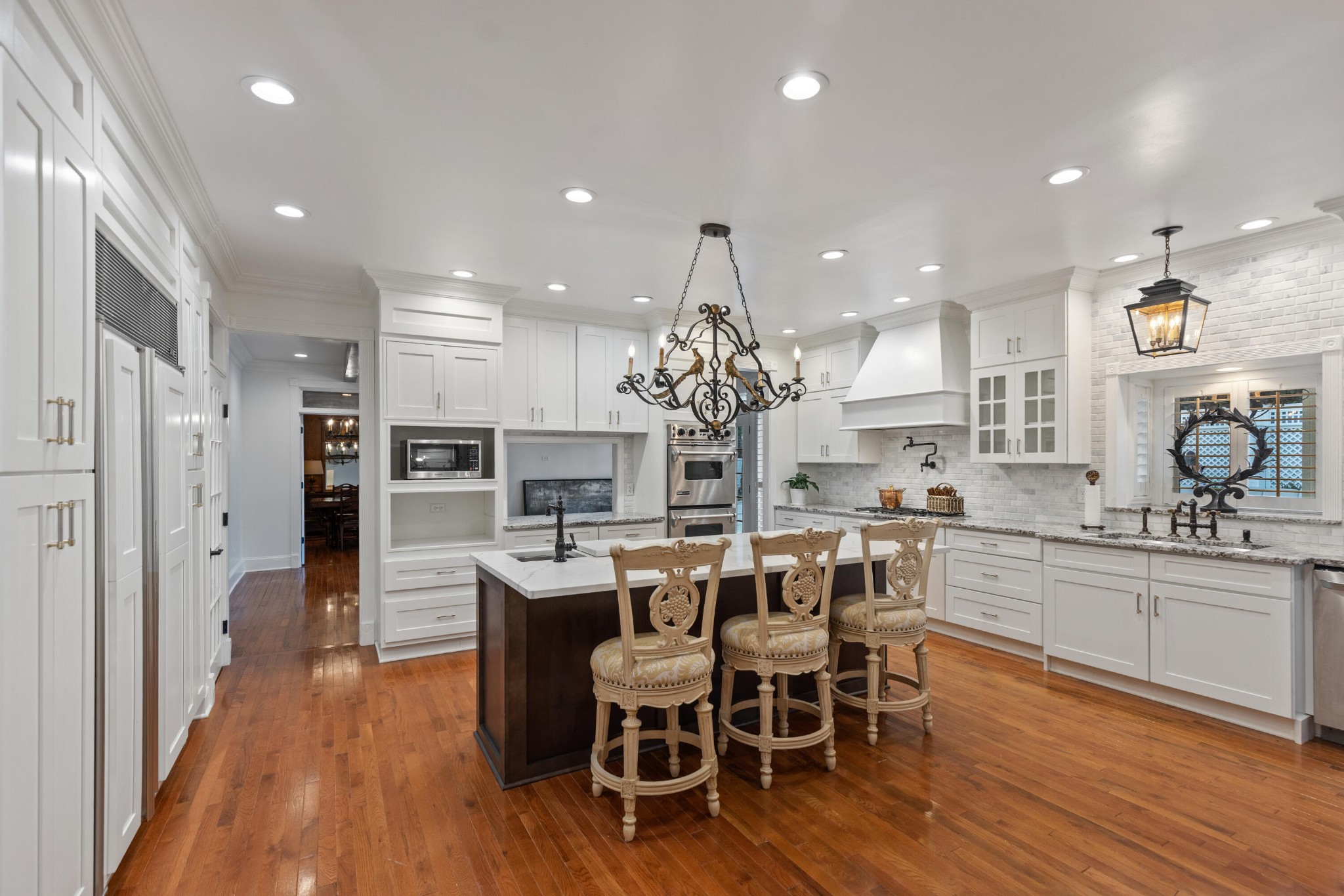 8421 Pedigo Road Powell, TN 37849 - Photo 8 of 57 a kitchen with stainless steel appliances kitchen island granite countertop a dining table chairs and sink