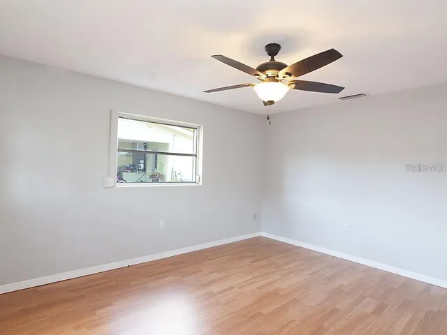 a view of an empty room with a window