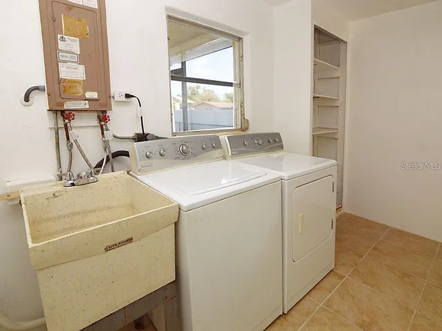 a utility room with dryer and washer