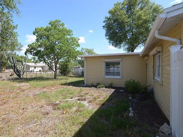 a backyard of a house with lots of green space