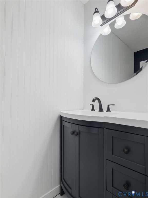 7707 Woodbrook Road Quinton, VA 23141 - Photo 33 of 42 Bathroom vanity featuring a dark gray cabinet, int