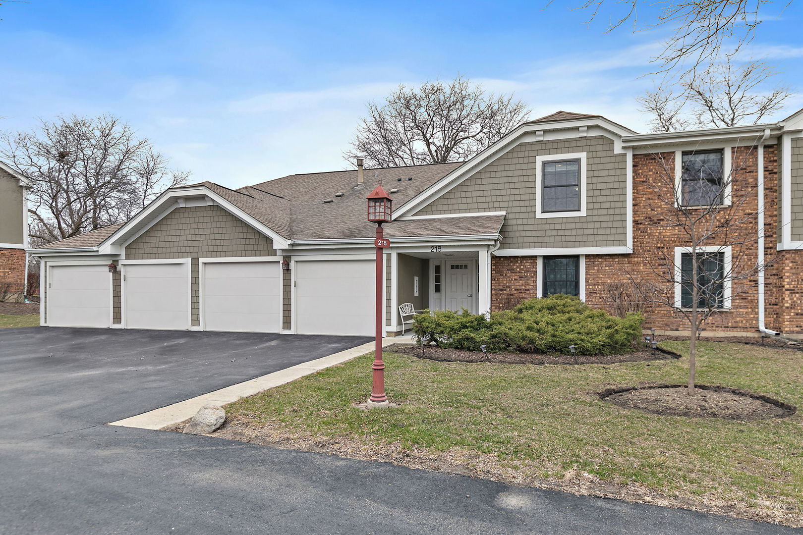 218 Deerpath Court, Unit B2 Schaumburg, IL 60193 - Photo 1 of 21 a front view of a house with garden