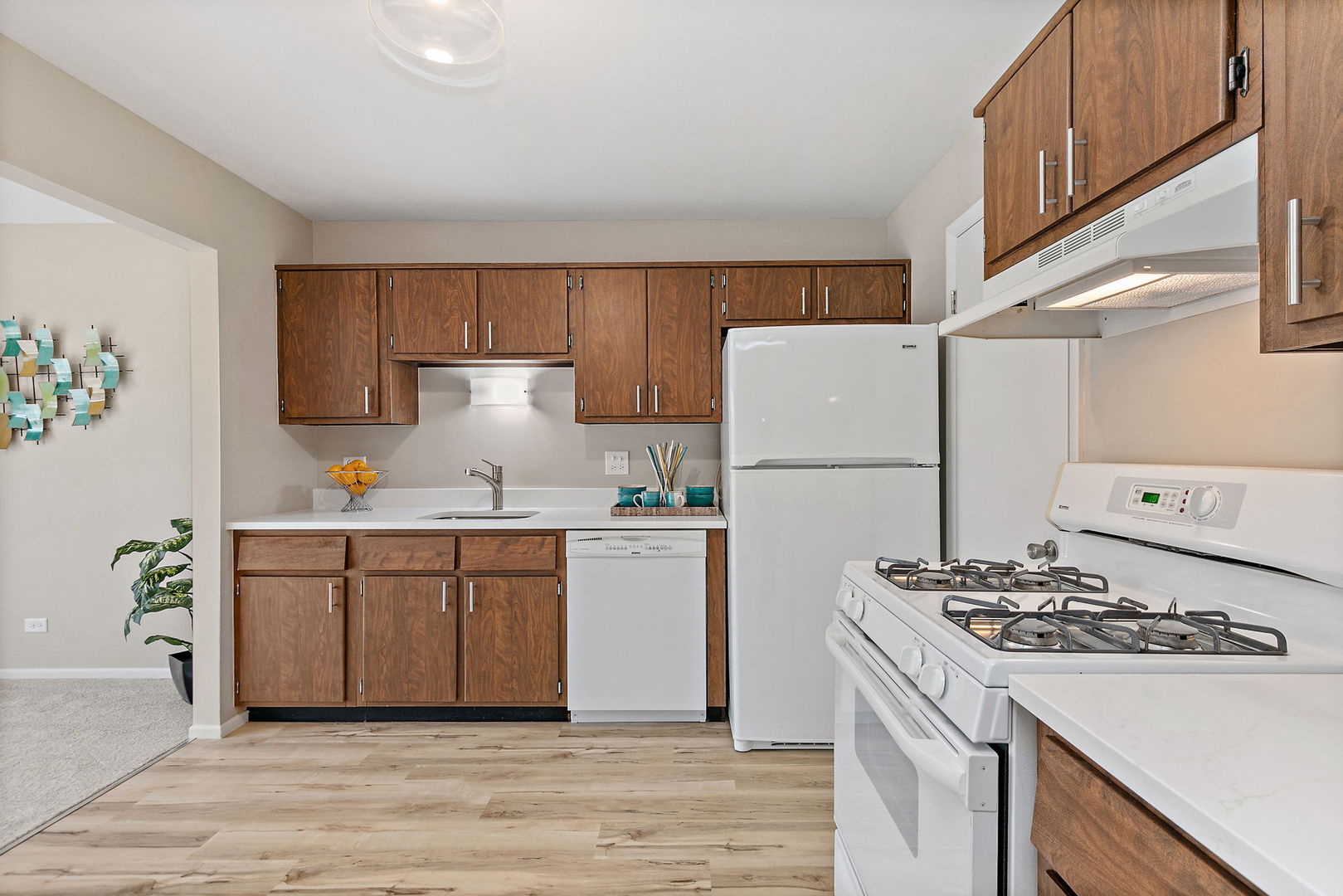 218 Deerpath Court, Unit B2 Schaumburg, IL 60193 - Photo 11 of 21 a kitchen with a white stove top oven and refrigerator