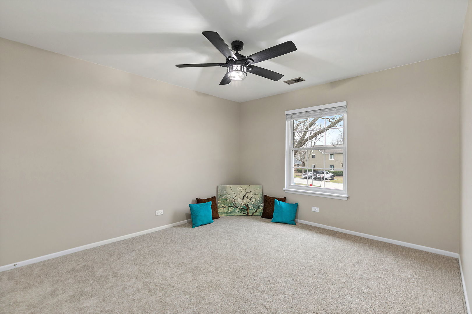 218 Deerpath Court, Unit B2 Schaumburg, IL 60193 - Photo 15 of 21 an empty room with windows and fan