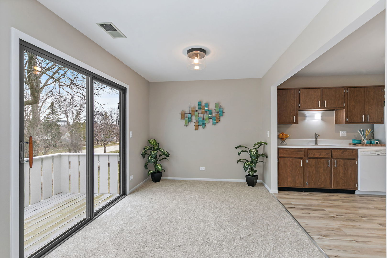 218 Deerpath Court, Unit B2 Schaumburg, IL 60193 - Photo 6 of 21 a living room with a large window and potted plant