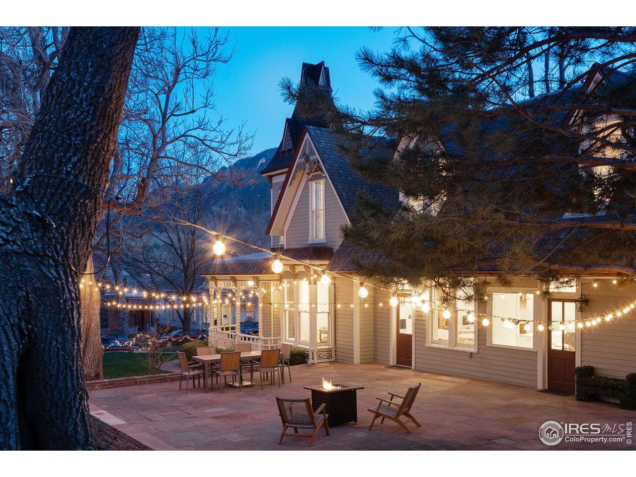 809 Pine Street Boulder, CO 80302 - Photo 11 of 13 a view of a porch with furniture and a yard