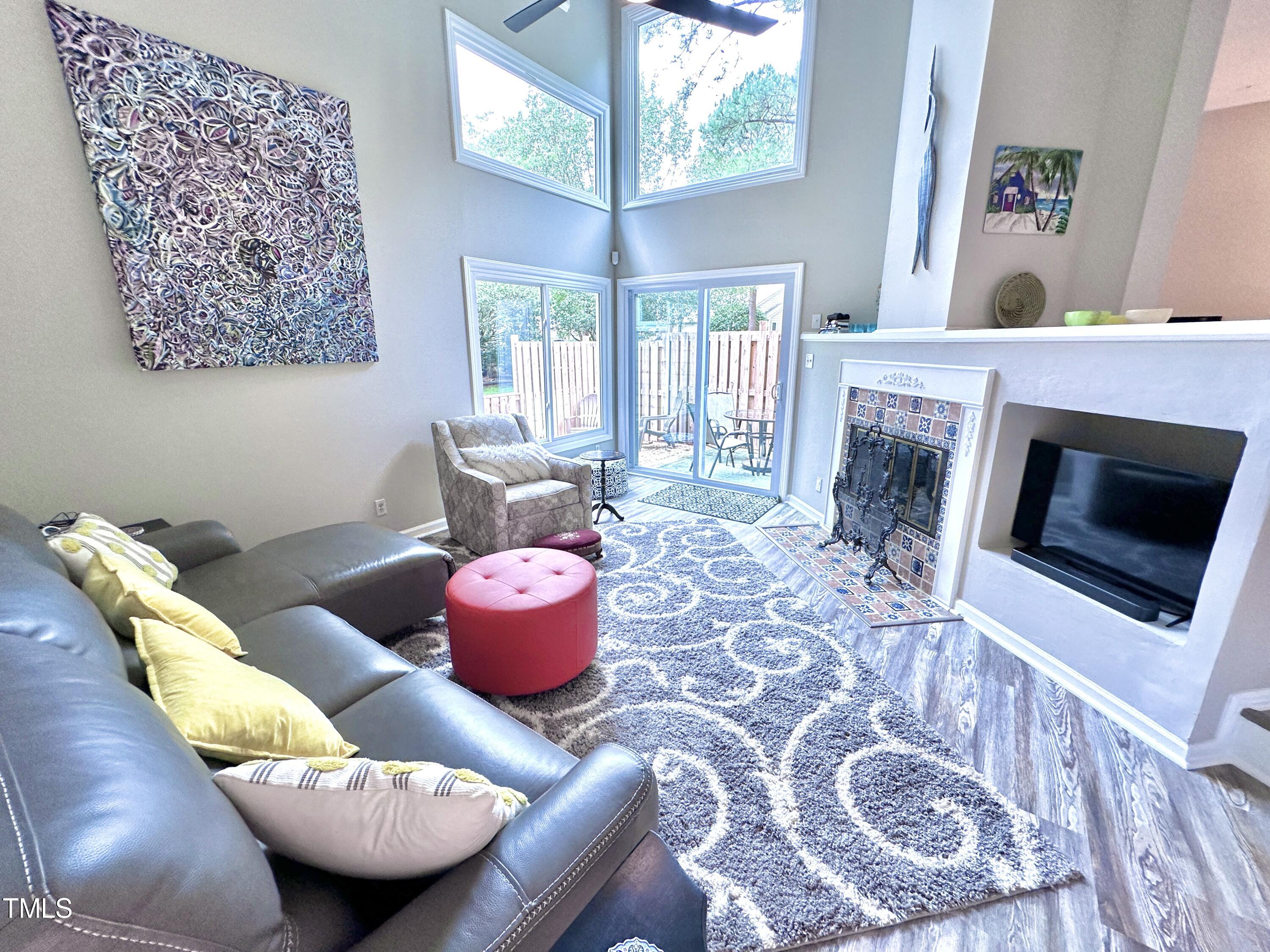 4311 Beechnut Lane Durham, NC 27707 - Photo 14 of 56 a living room with furniture and a fireplace