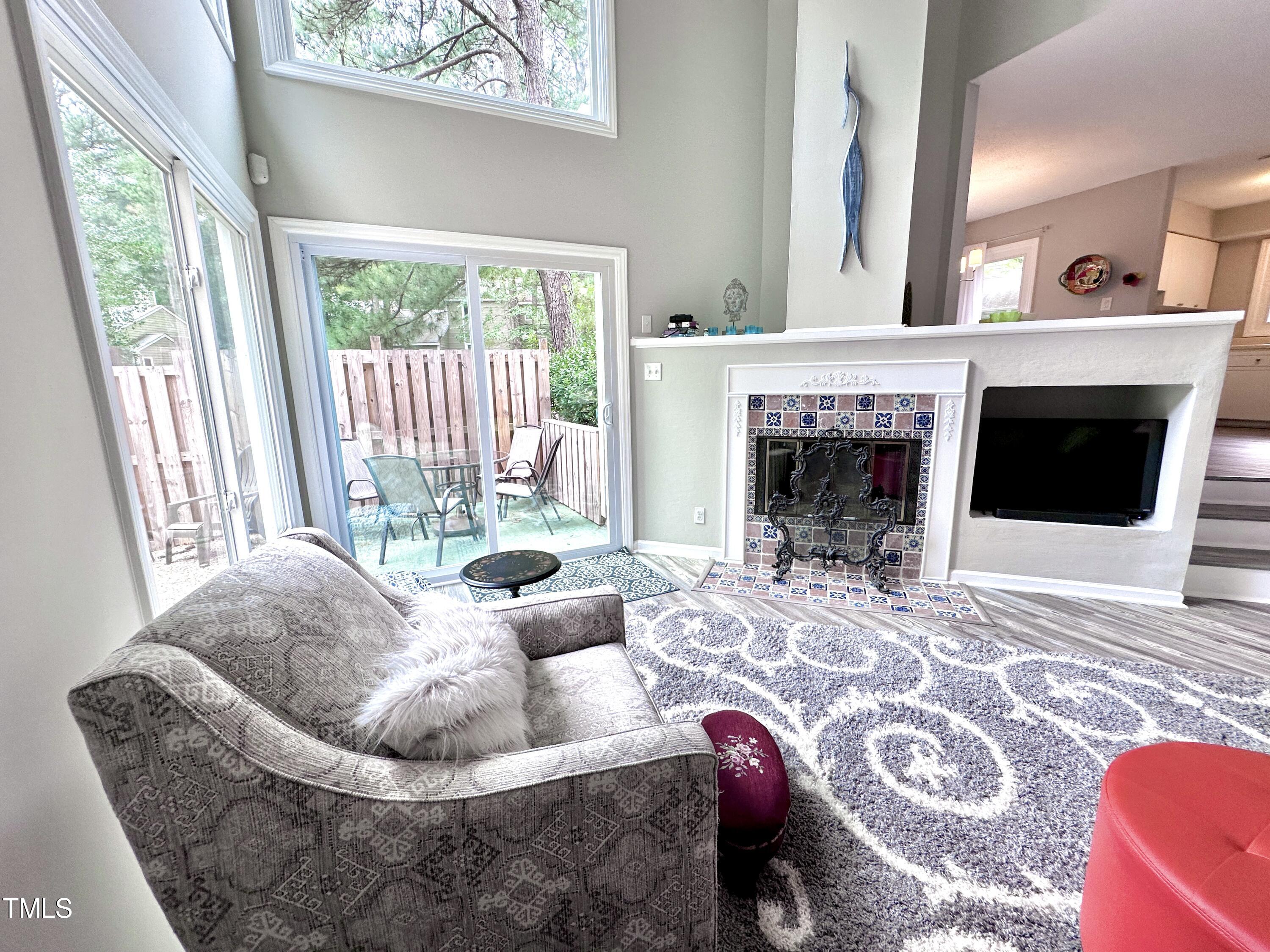 4311 Beechnut Lane Durham, NC 27707 - Photo 17 of 56 a living room with furniture and a fireplace