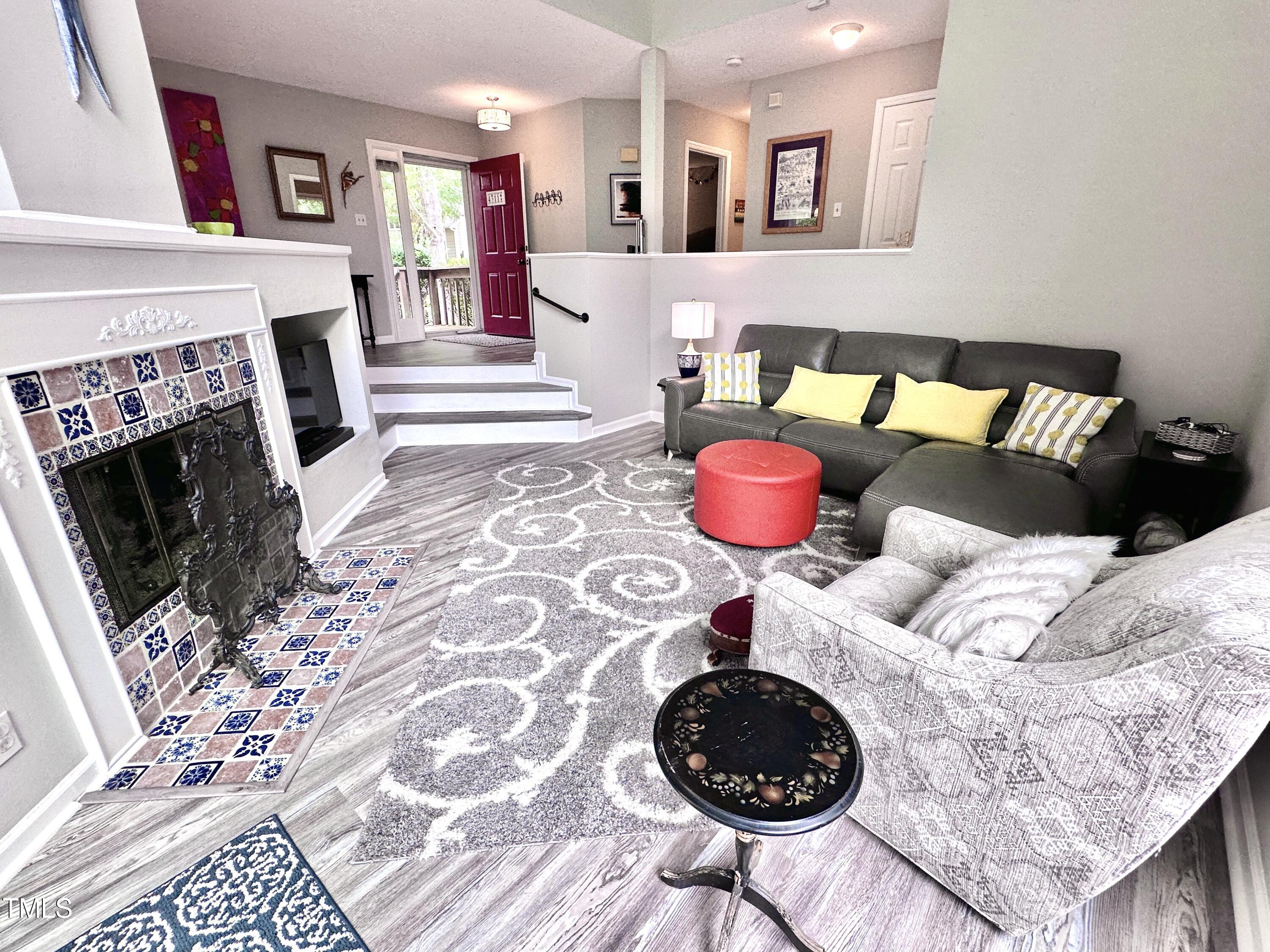 4311 Beechnut Lane Durham, NC 27707 - Photo 19 of 56 a bedroom with a bed and a fireplace