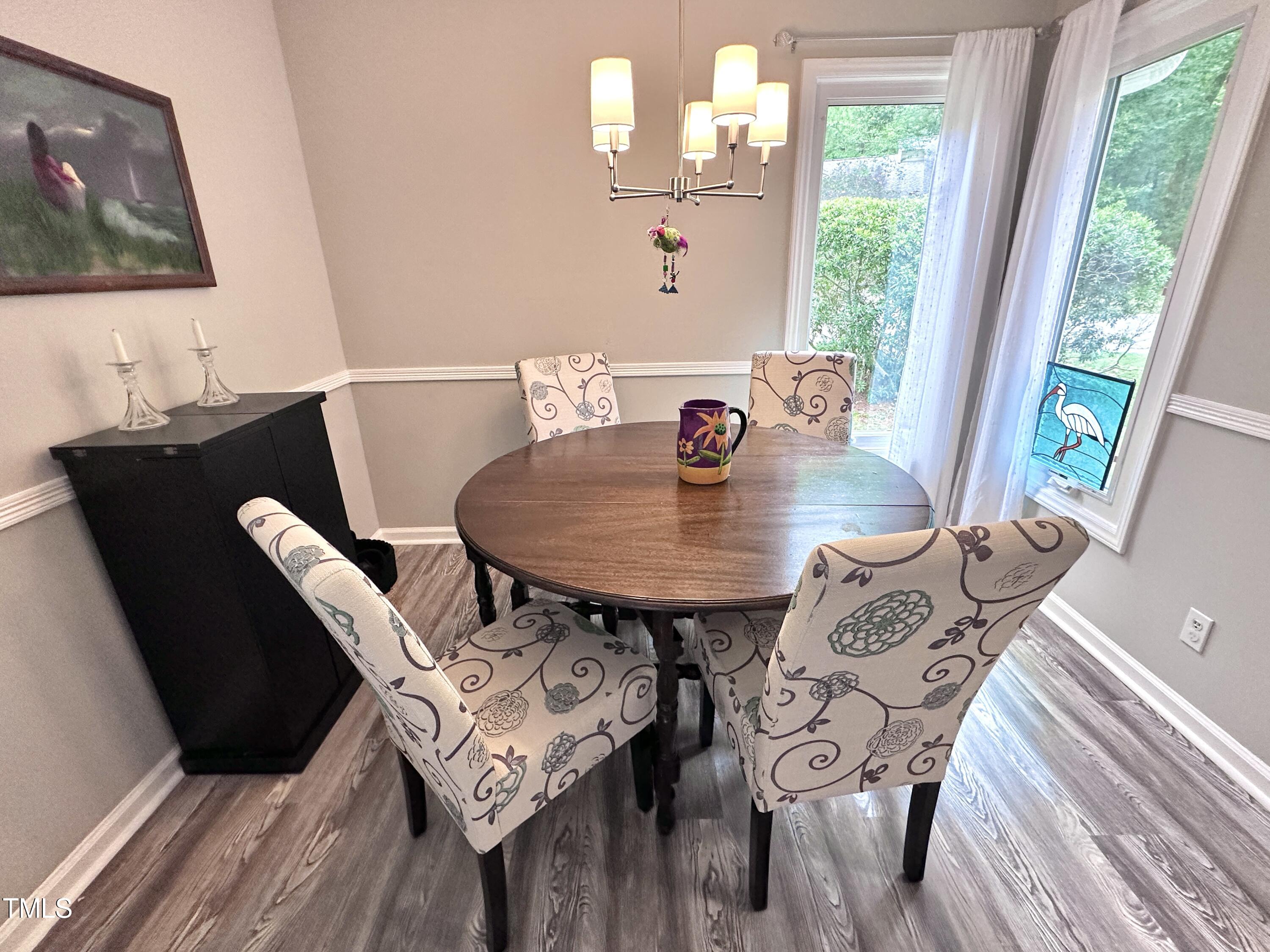4311 Beechnut Lane Durham, NC 27707 - Photo 21 of 56 a view of a dining room with furniture window and outside view