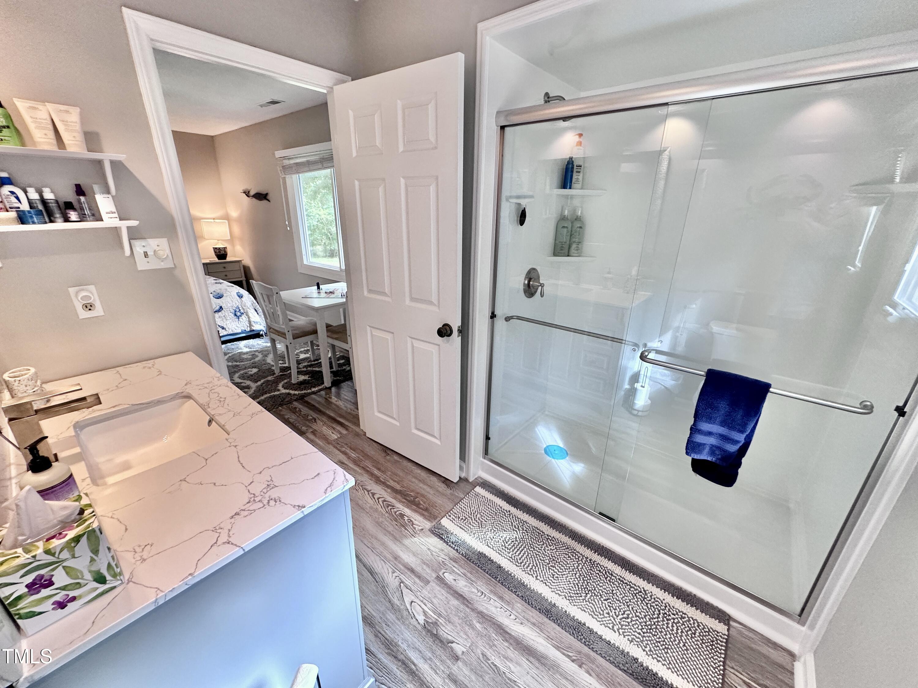 4311 Beechnut Lane Durham, NC 27707 - Photo 36 of 56 a kitchen with a refrigerator and a stove top oven