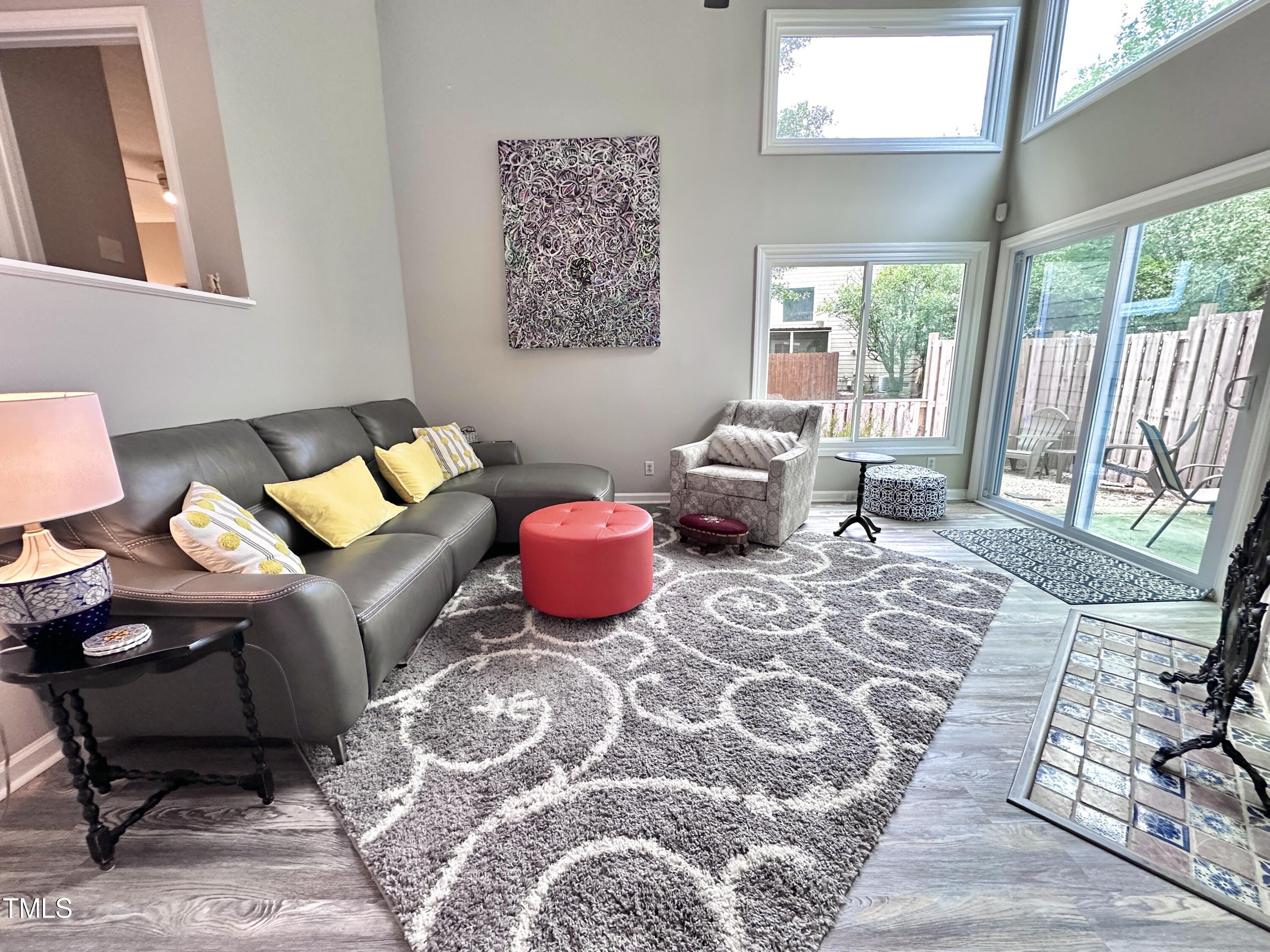 4311 Beechnut Lane Durham, NC 27707 - Photo 4 of 56 a living room with furniture and a floor to ceiling window
