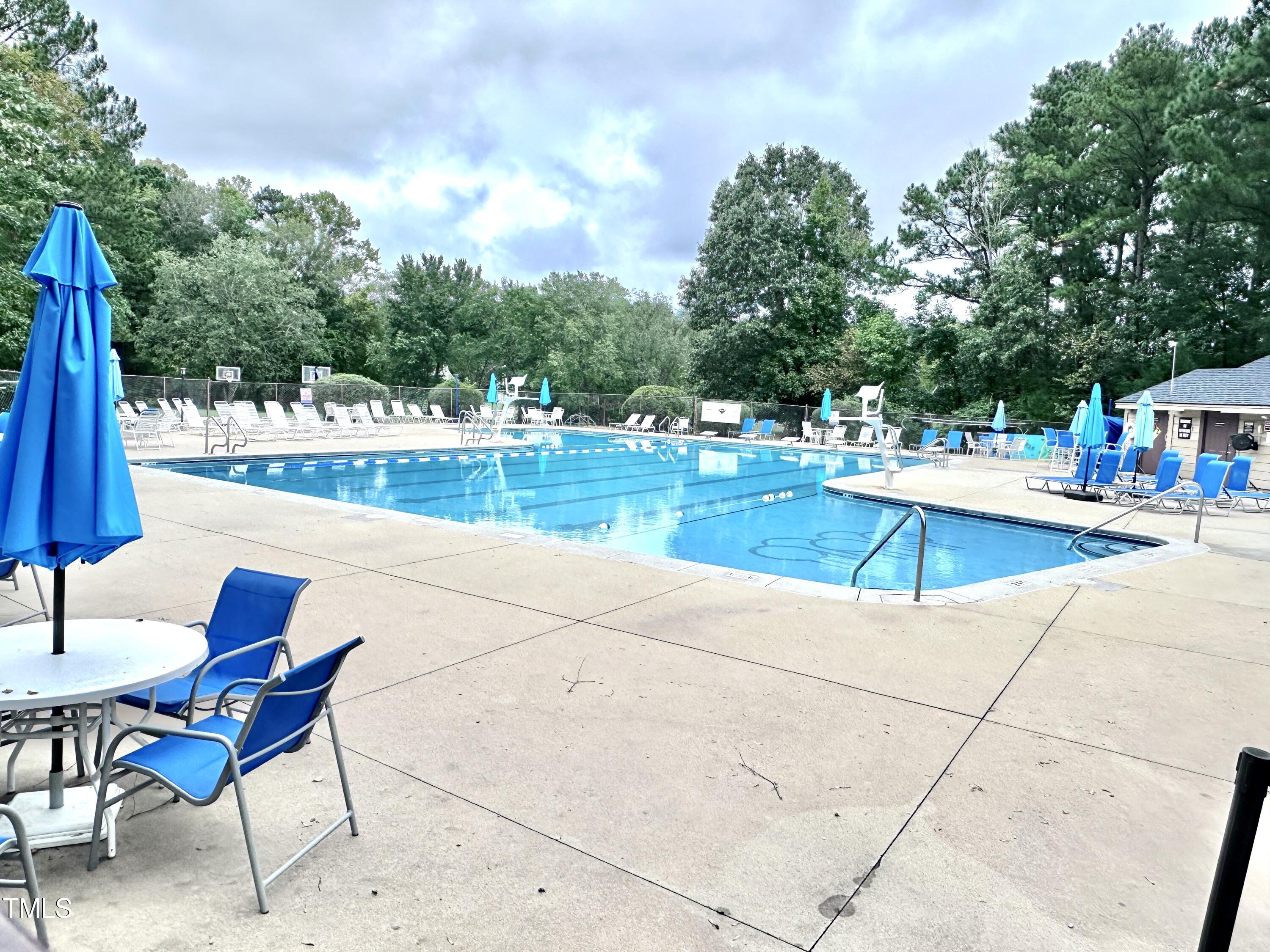 4311 Beechnut Lane Durham, NC 27707 - Photo 53 of 56 a view of a swimming pool with a lounge chairs