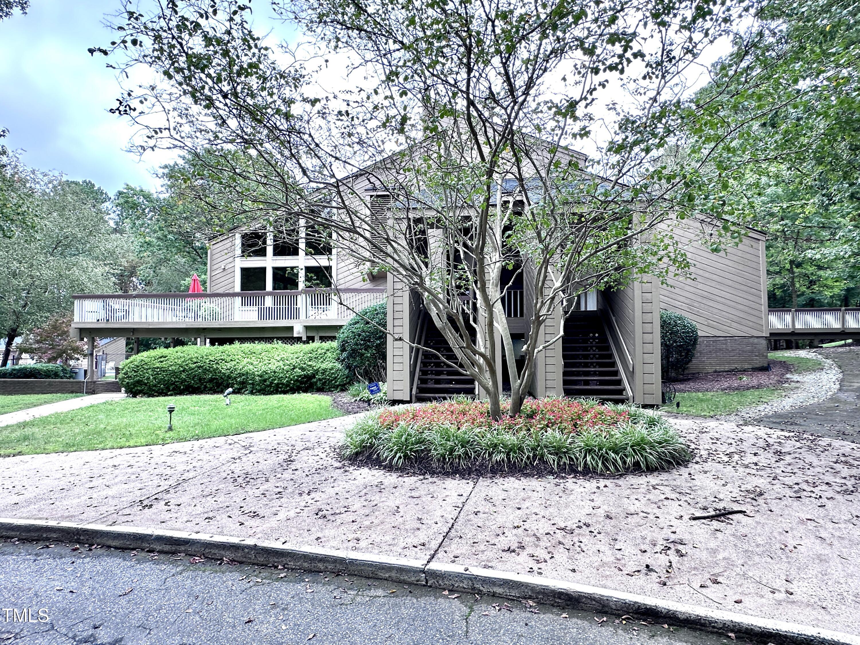 4311 Beechnut Lane Durham, NC 27707 - Photo 54 of 56 a front view of a house with a yard and a garage