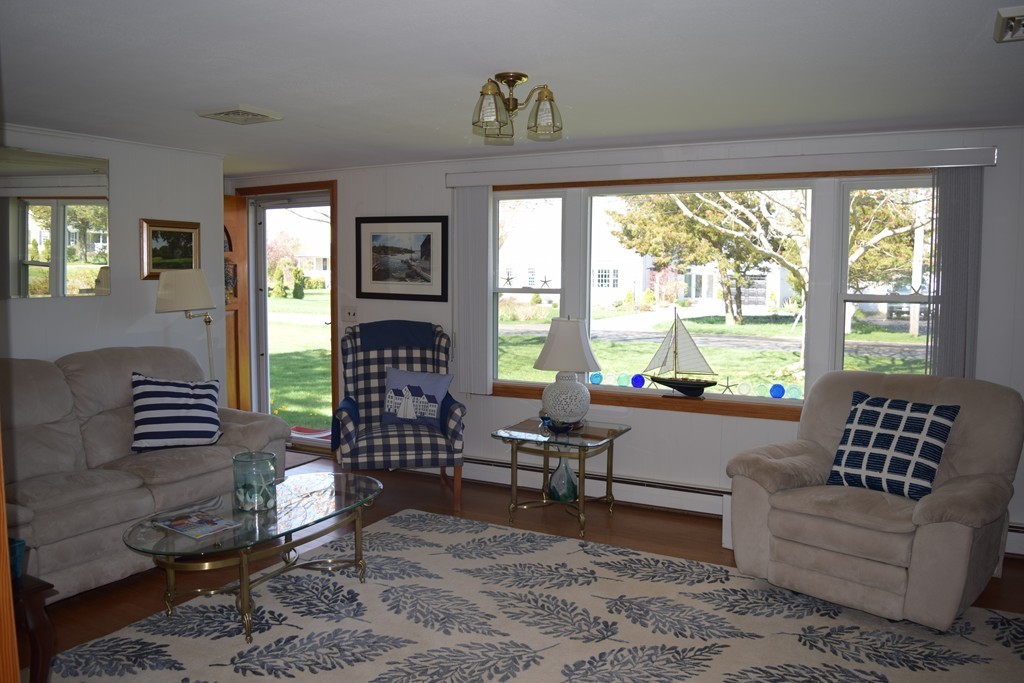 106 Williston Road Bourne, MA 02562 - Photo 5 of 9 a living room with furniture and a large window