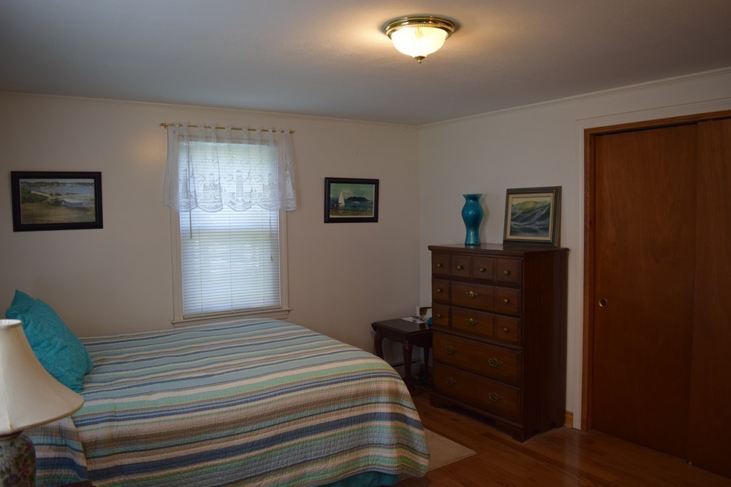 106 Williston Road Bourne, MA 02562 - Photo 8 of 9 a bedroom with a bed and a window