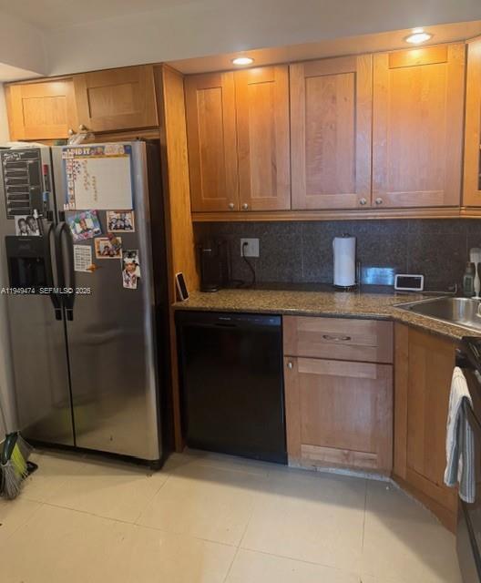 4164 Inverrary Drive, Unit 913 Lauderhill, FL 33319 - Photo 13 of 25 a kitchen with a sink and cabinets