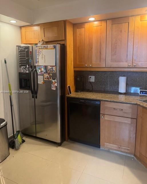 4164 Inverrary Drive, Unit 913 Lauderhill, FL 33319 - Photo 14 of 25 a kitchen with stainless steel appliances a refrigerator and cabinets