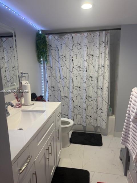 4164 Inverrary Drive, Unit 913 Lauderhill, FL 33319 - Photo 18 of 25 a bathroom with a sink a toilet and shower