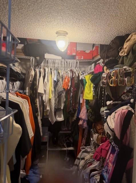 4164 Inverrary Drive, Unit 913 Lauderhill, FL 33319 - Photo 19 of 25 a view of walk in closet with clothes