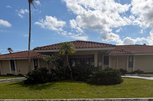 4164 Inverrary Drive, Unit 913 Lauderhill, FL 33319 - Photo 22 of 25 a front view of a house with garden