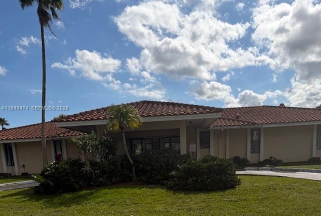 4164 Inverrary Drive, Unit 913 Lauderhill, FL 33319 - Photo 23 of 25 a front view of a house with garden