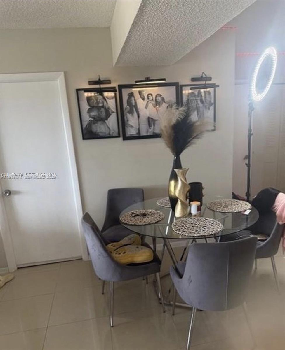 4164 Inverrary Drive, Unit 913 Lauderhill, FL 33319 - Photo 25 of 25 a dining room with furniture and wooden floor