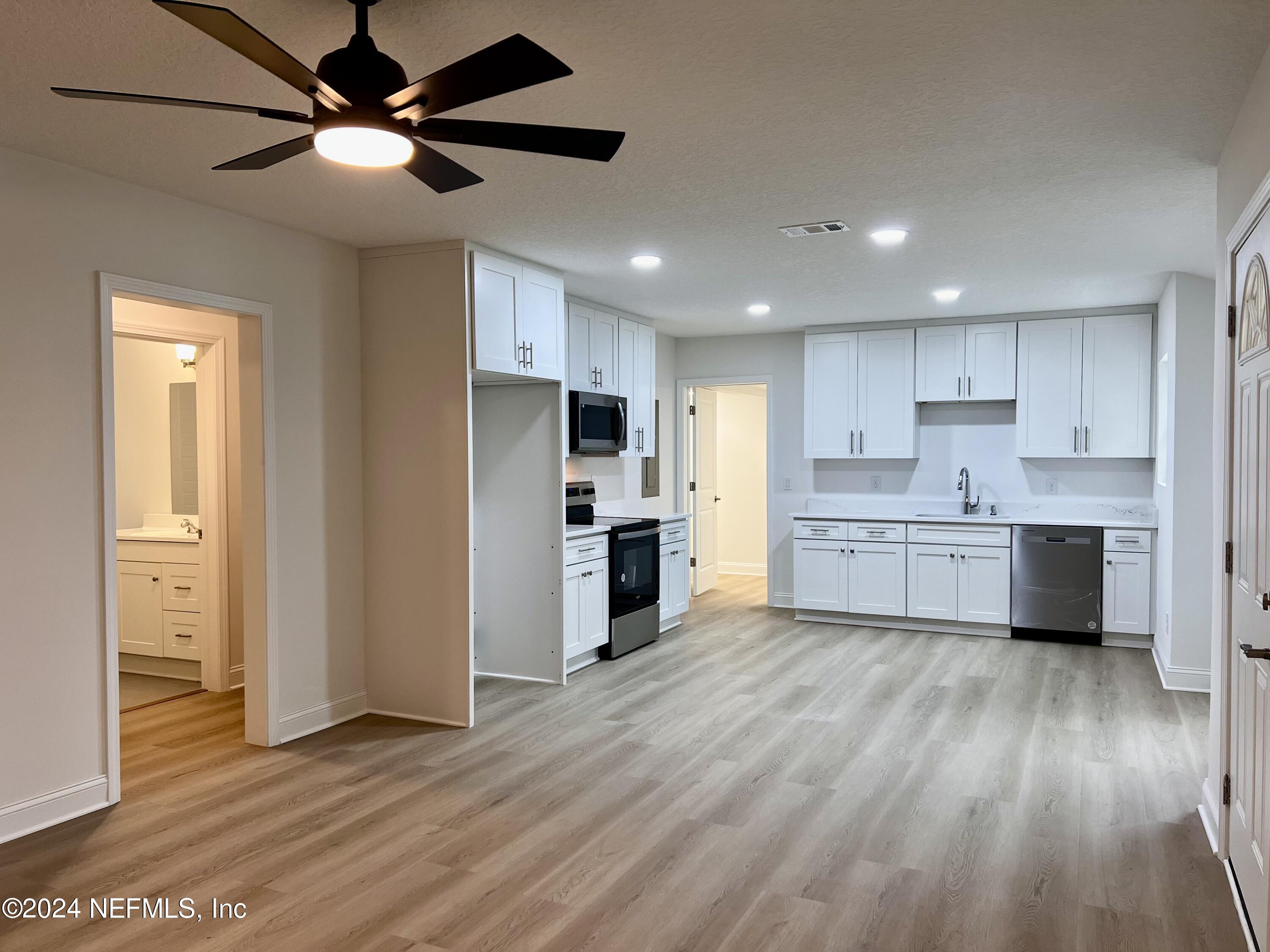 1833 Bartram Road Jacksonville, FL 32207 - Photo 13 of 50 a view of a kitchen with wooden floor and a kitchen