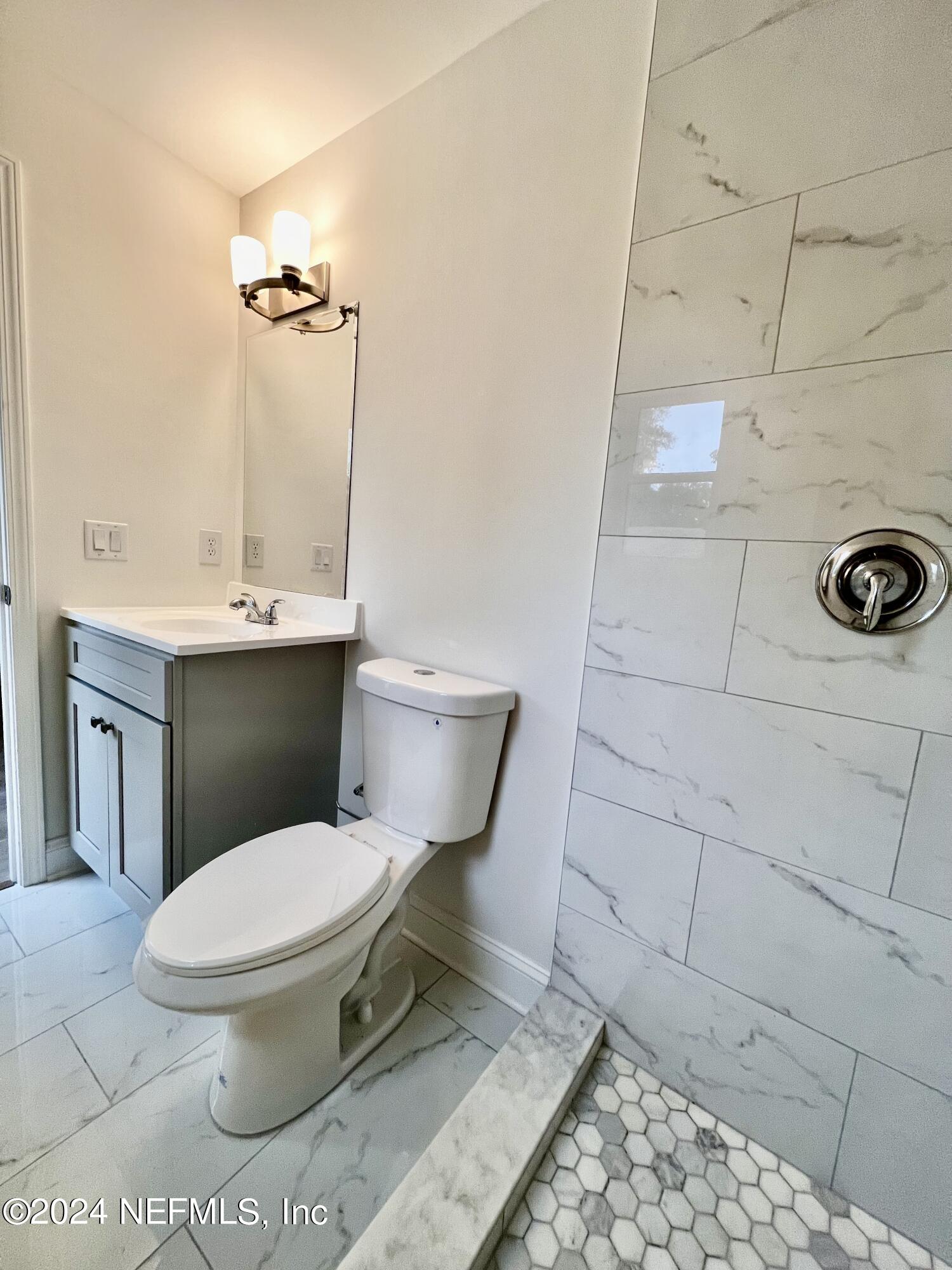 1833 Bartram Road Jacksonville, FL 32207 - Photo 18 of 50 a bathroom with a toilet and a sink