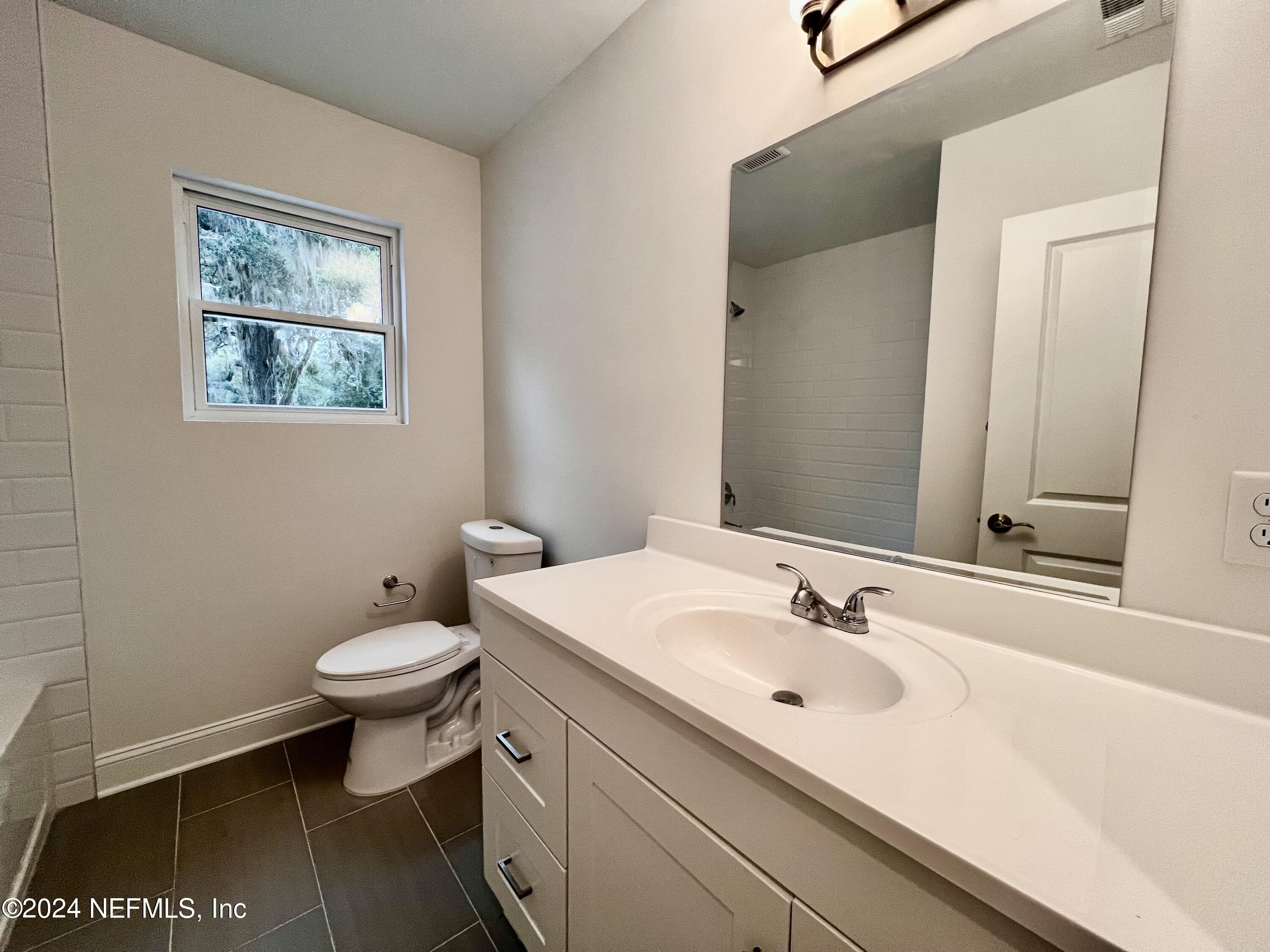 1833 Bartram Road Jacksonville, FL 32207 - Photo 21 of 50 a bathroom with a sink and a toilet