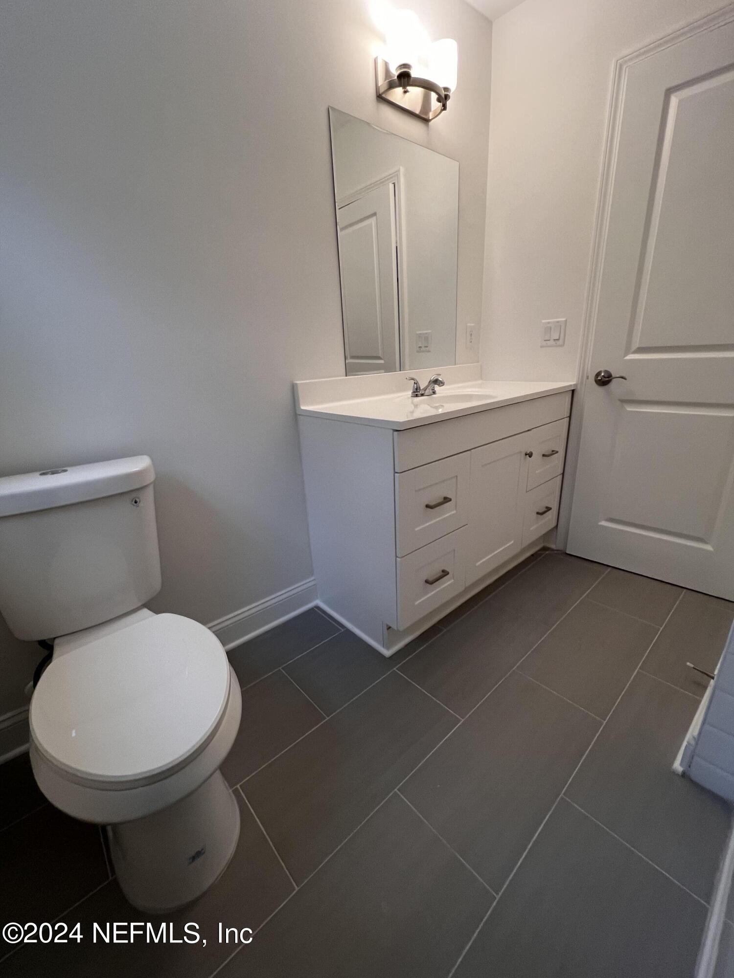 1833 Bartram Road Jacksonville, FL 32207 - Photo 24 of 50 a bathroom with a toilet and a sink