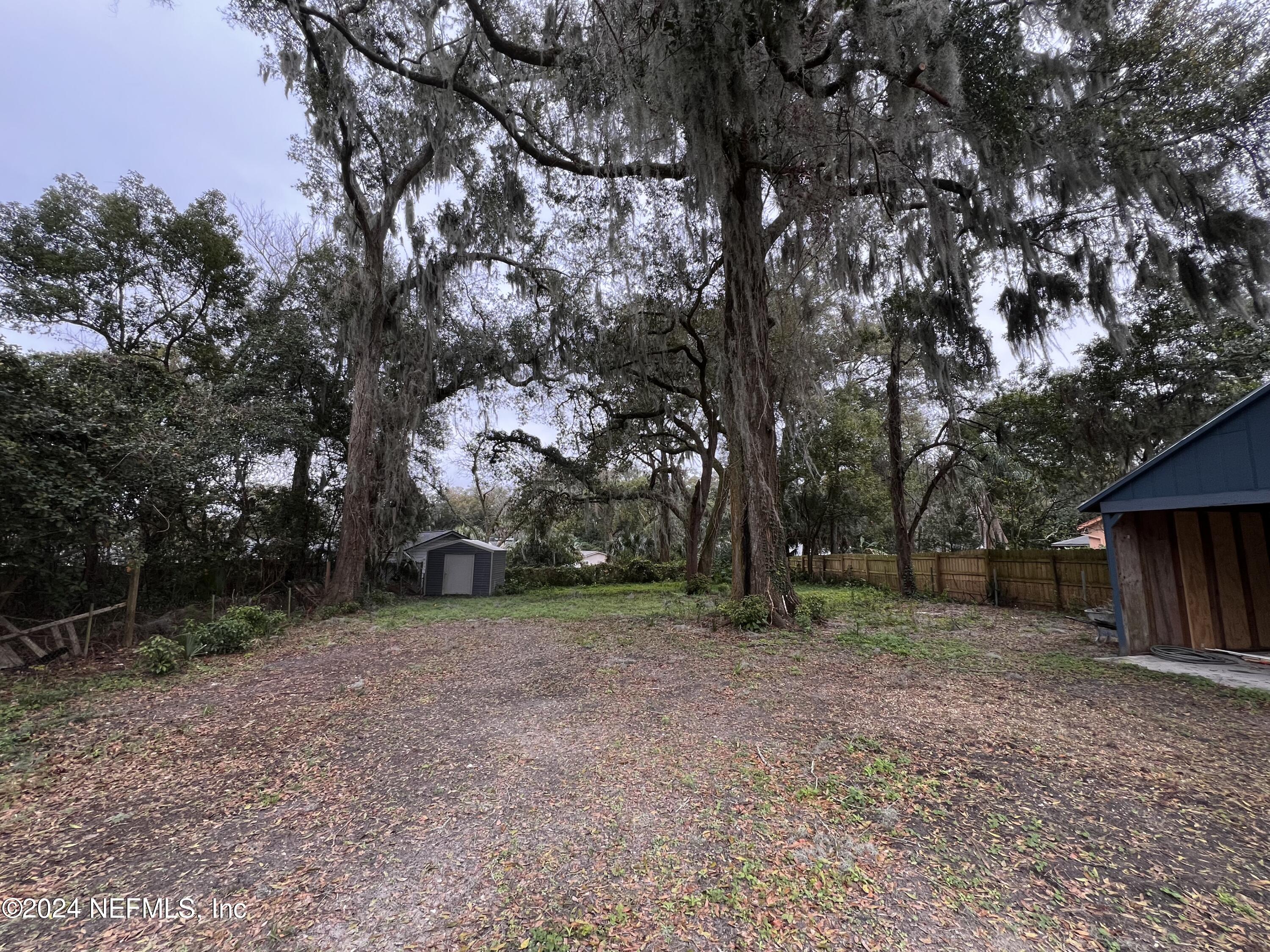 1833 Bartram Road Jacksonville, FL 32207 - Photo 34 of 50 a view of a backyard with large trees