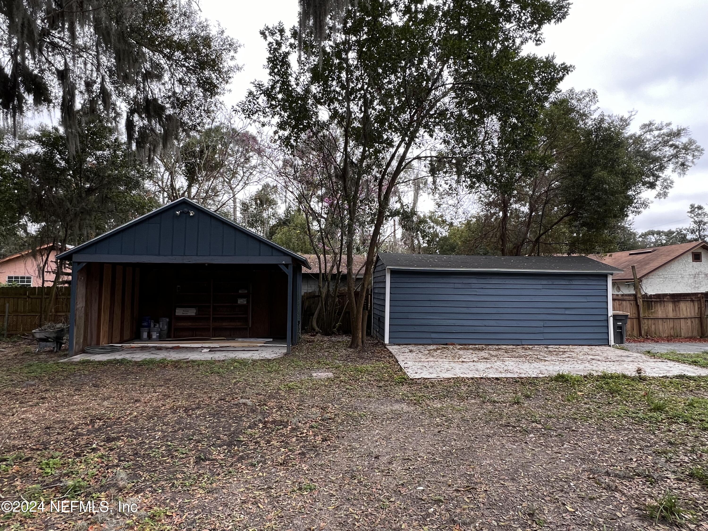 1833 Bartram Road Jacksonville, FL 32207 - Photo 35 of 50 a house with trees in front of it