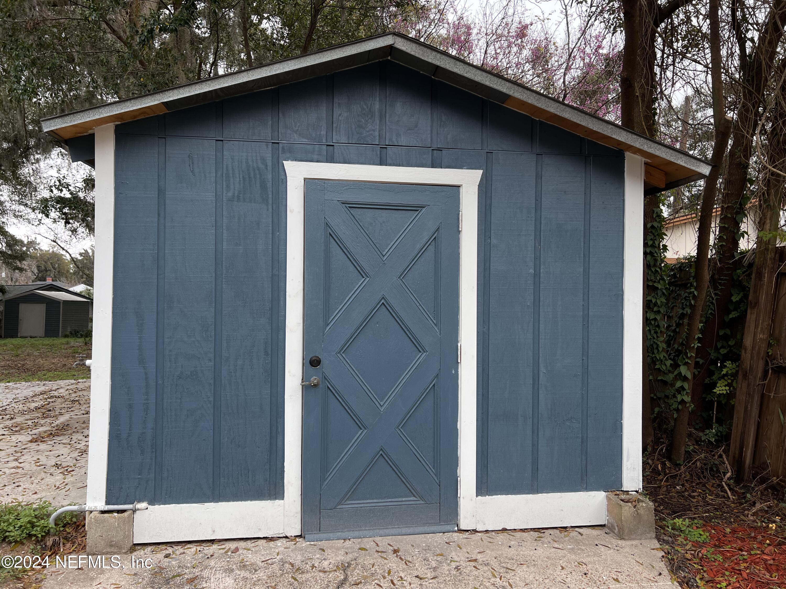 1833 Bartram Road Jacksonville, FL 32207 - Photo 41 of 50 a house with trees in the background