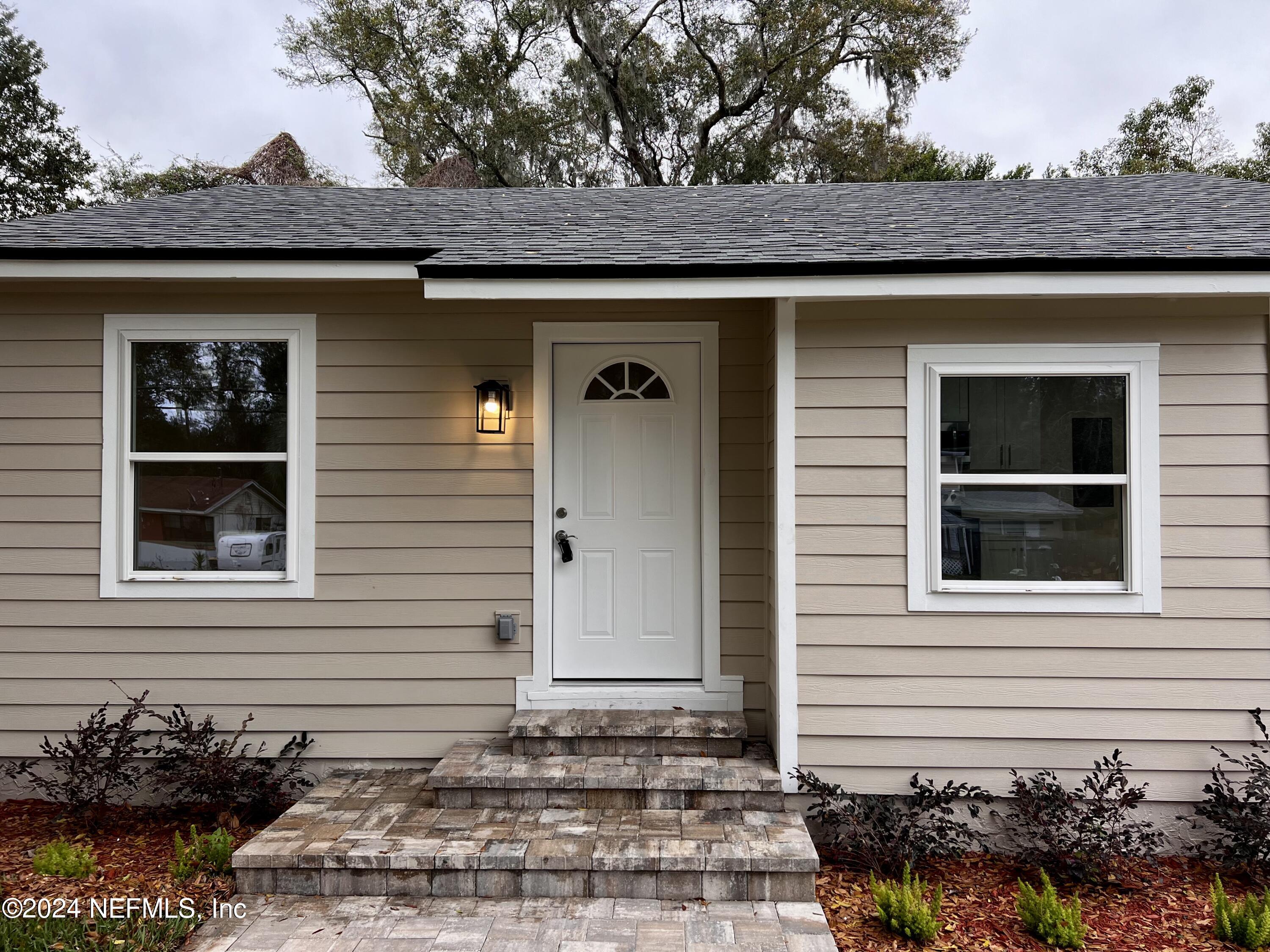 1833 Bartram Road Jacksonville, FL 32207 - Photo 45 of 50 a front view of a house with a garden