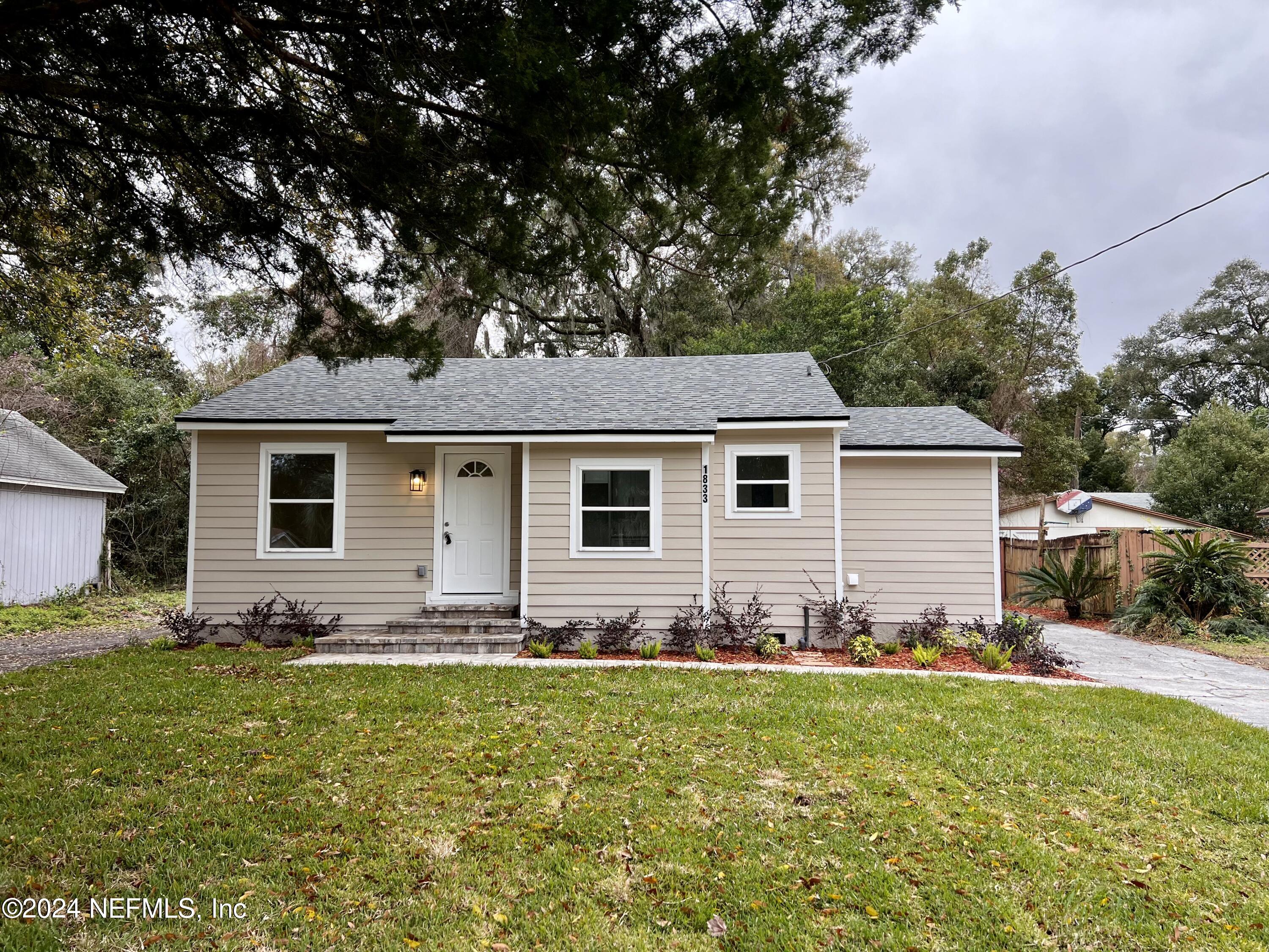1833 Bartram Road Jacksonville, FL 32207 - Photo 47 of 50 a front view of house with yard having outdoor seating