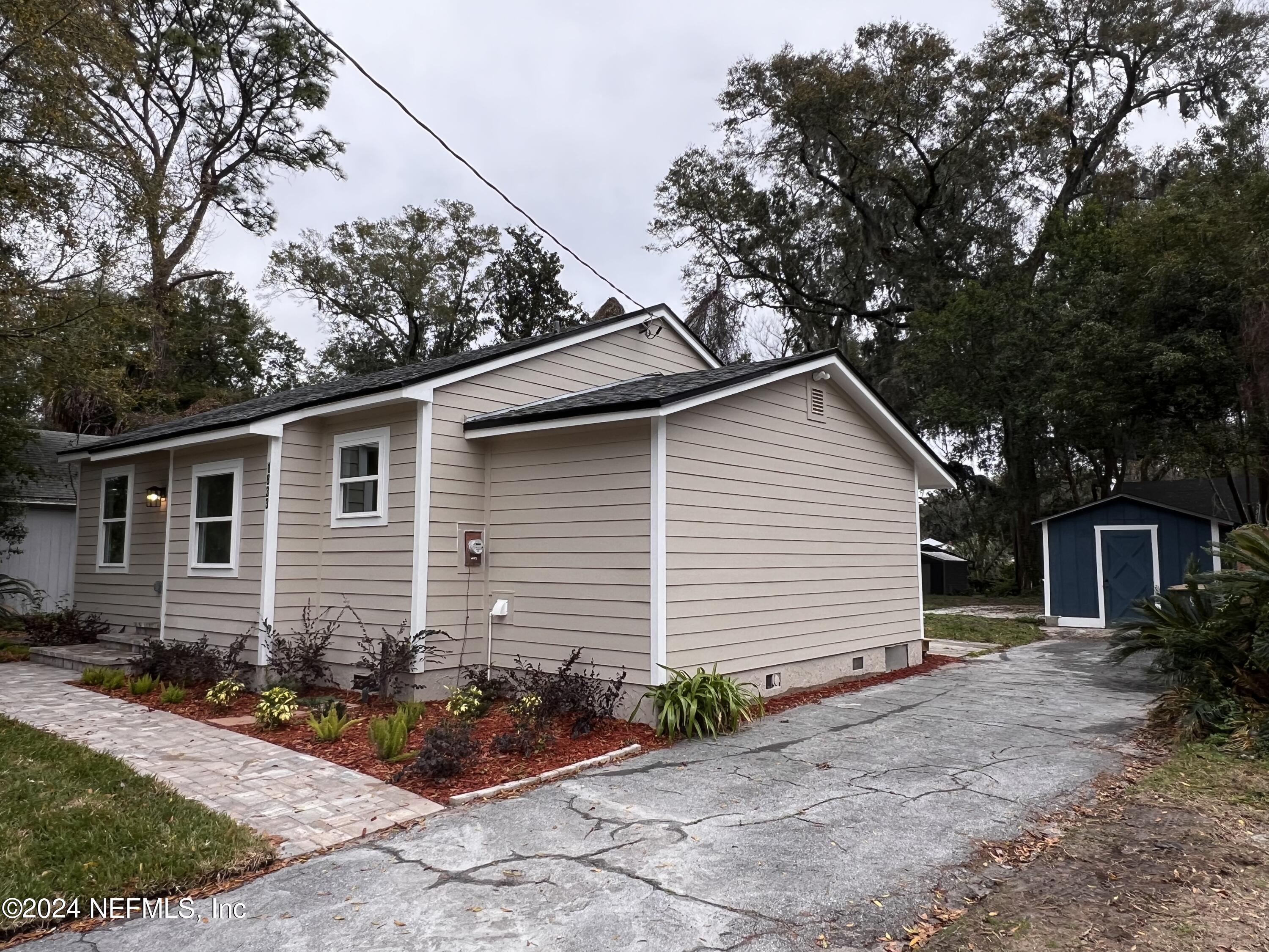 1833 Bartram Road Jacksonville, FL 32207 - Photo 49 of 50 a house with trees in the background