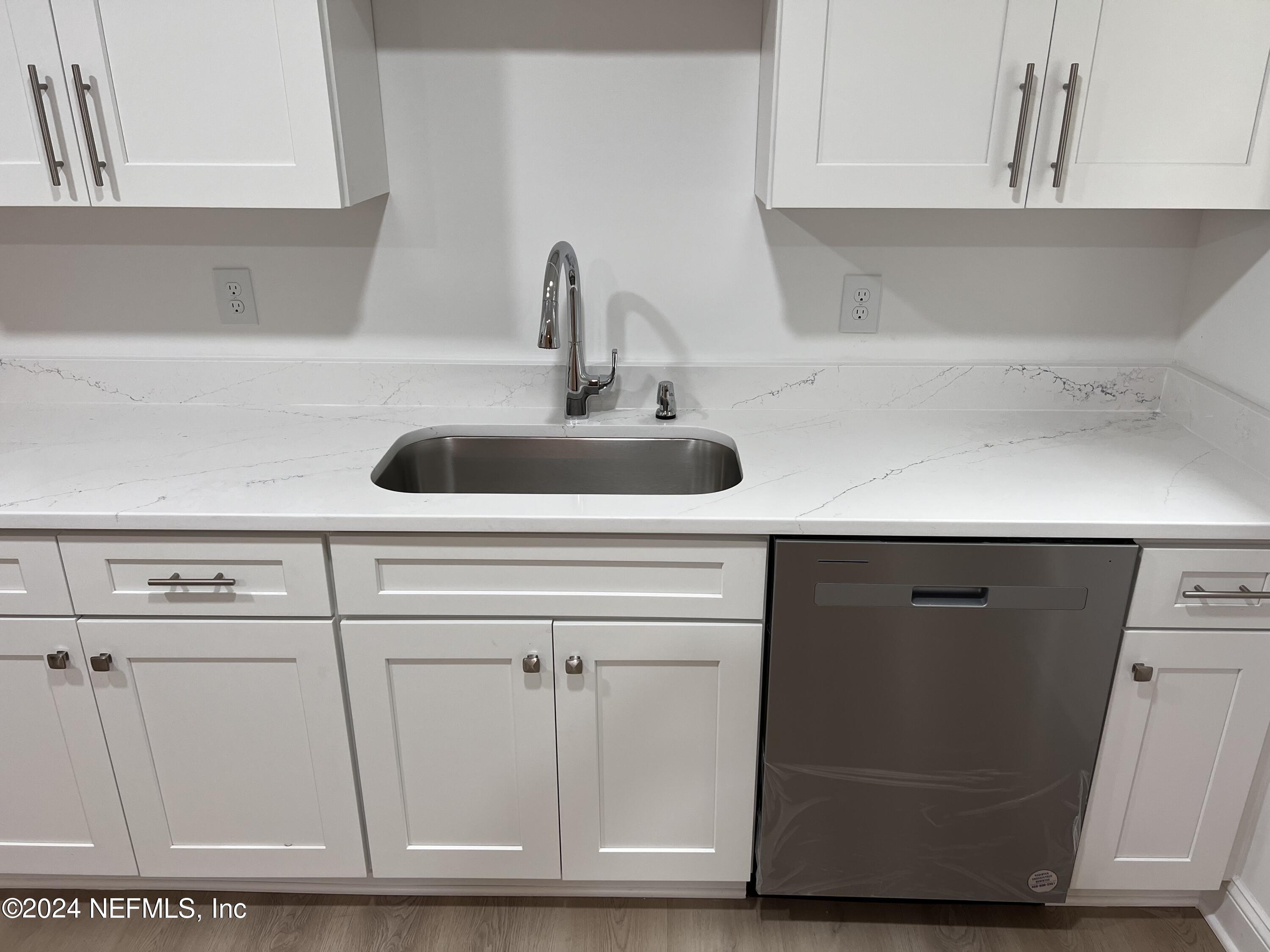 1833 Bartram Road Jacksonville, FL 32207 - Photo 6 of 50 a kitchen with a sink and cabinets