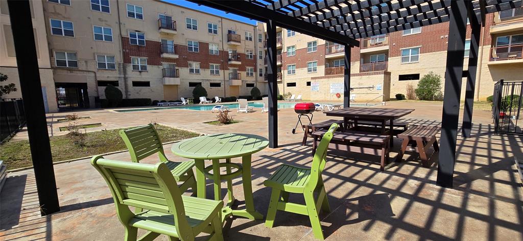 1100 West Trinity Mills Road, Unit 2045 Carrollton, TX 75006 - Photo 16 of 20 View of patio with a pergola and a community pool