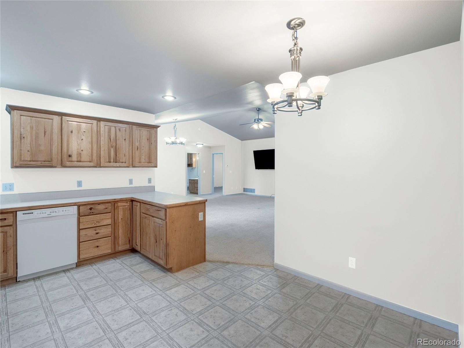 1436 H Street, Unit D Salida, CO 81201 - Photo 13 of 31 a kitchen with a cabinets and chandelier