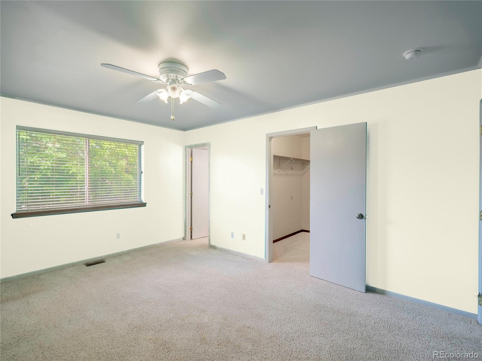 1436 H Street, Unit D Salida, CO 81201 - Photo 19 of 31 an empty room with a ceiling fan and a window