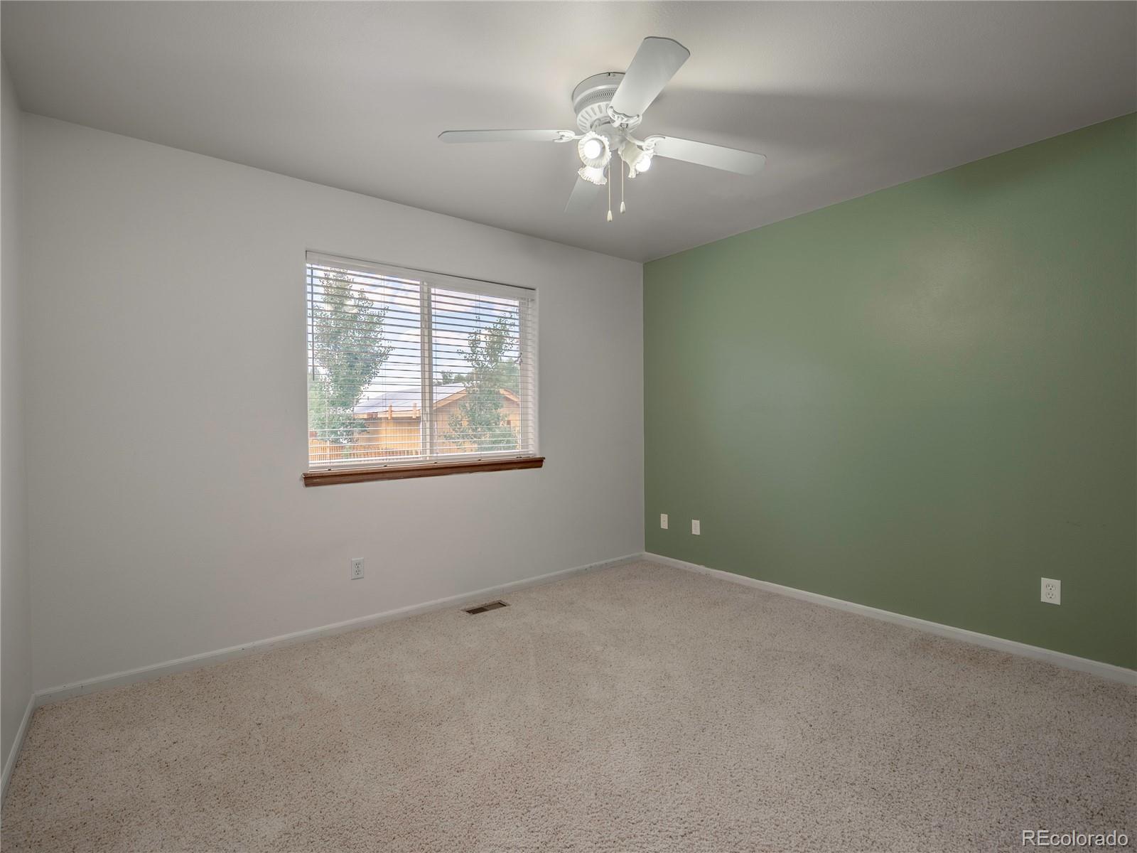 1436 H Street, Unit D Salida, CO 81201 - Photo 21 of 31 an empty room with windows and fan