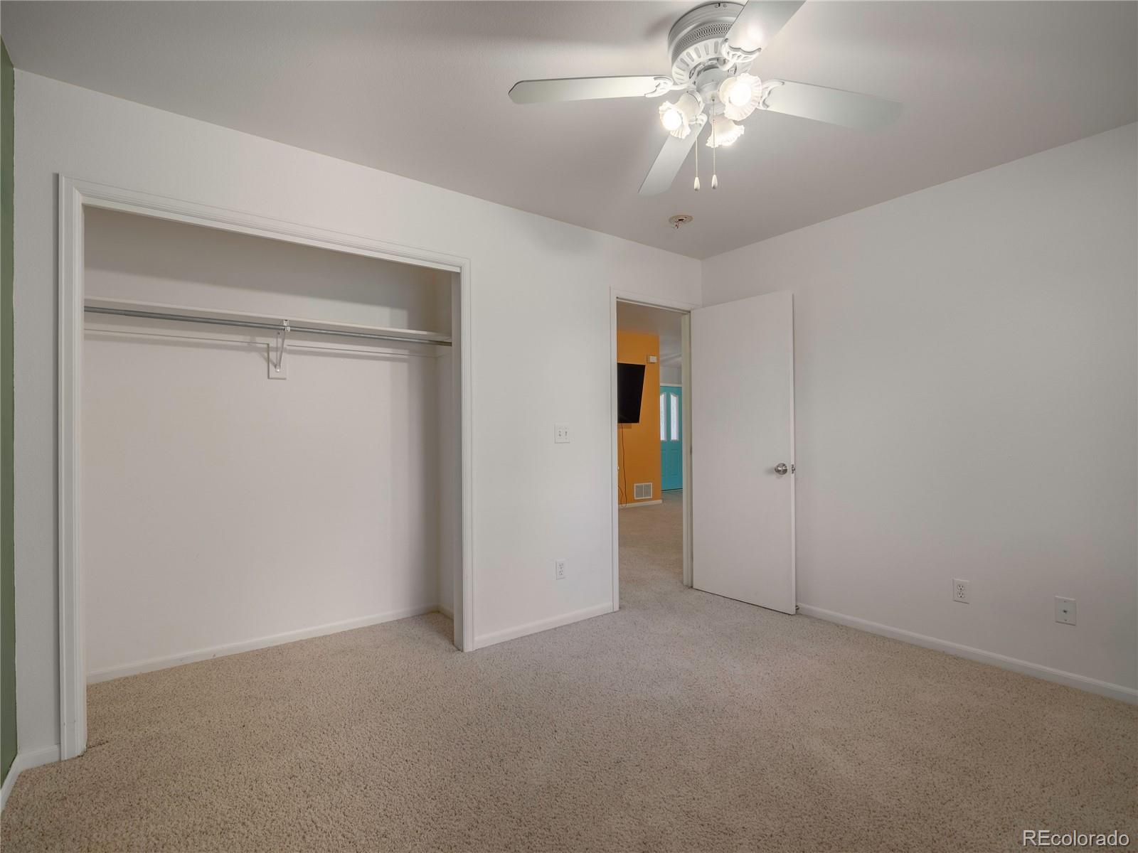 1436 H Street, Unit D Salida, CO 81201 - Photo 22 of 31 a view of a room with a ceiling fan and a chandelier fan