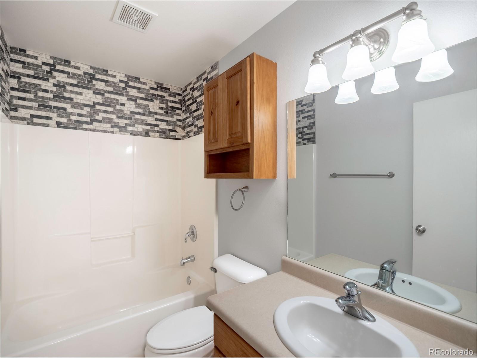 1436 H Street, Unit D Salida, CO 81201 - Photo 23 of 31 a bathroom with a sink a toilet and shower