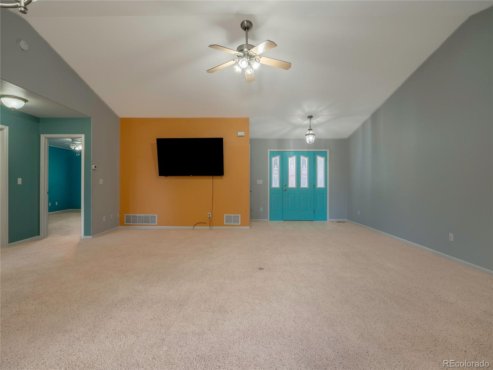 1436 H Street, Unit D Salida, CO 81201 - Photo 4 of 31 a view of an empty room with chandelier fan and windows