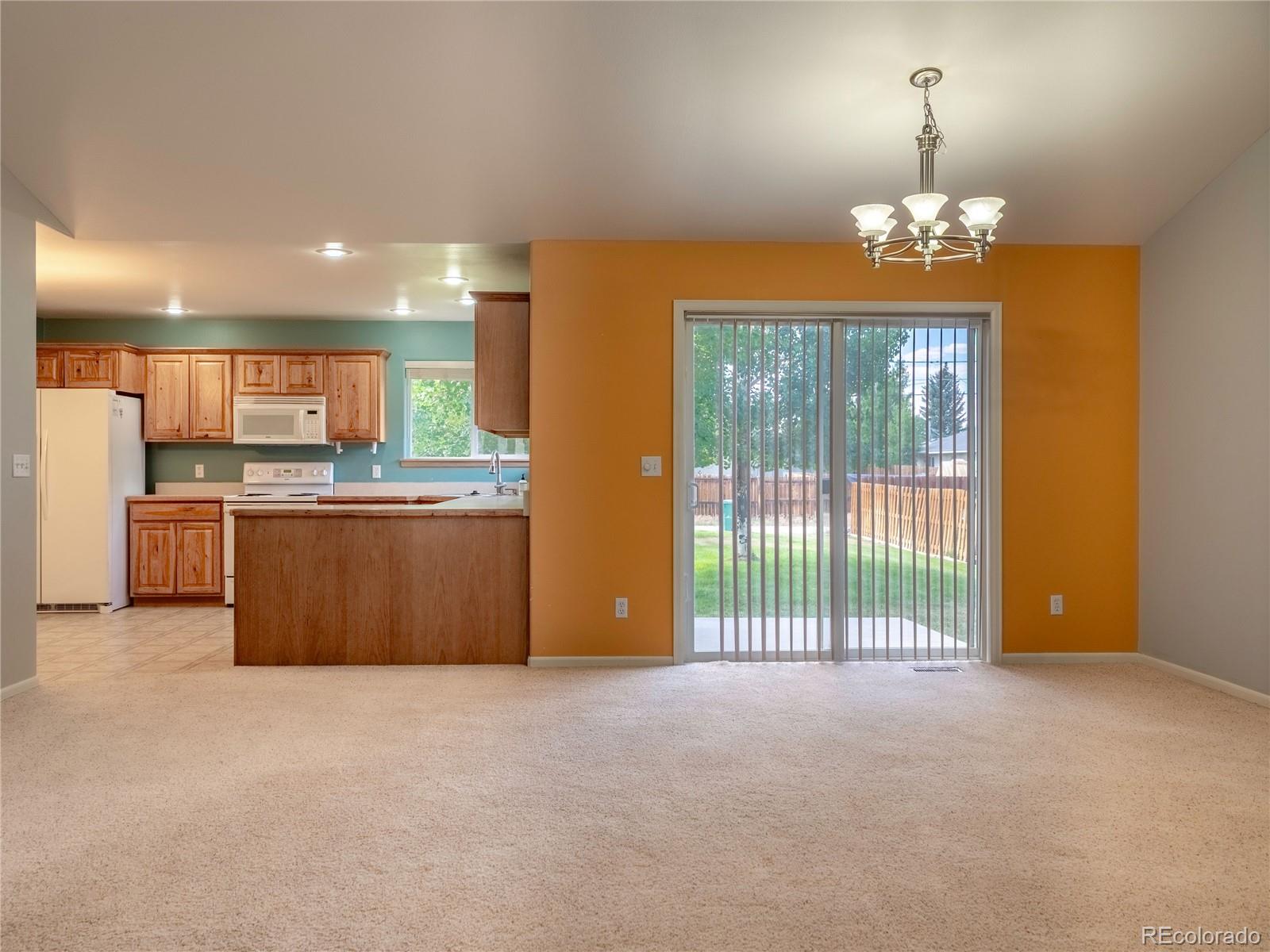 1436 H Street, Unit D Salida, CO 81201 - Photo 6 of 31 a view of a kitchen with a sink cabinet and a fireplace