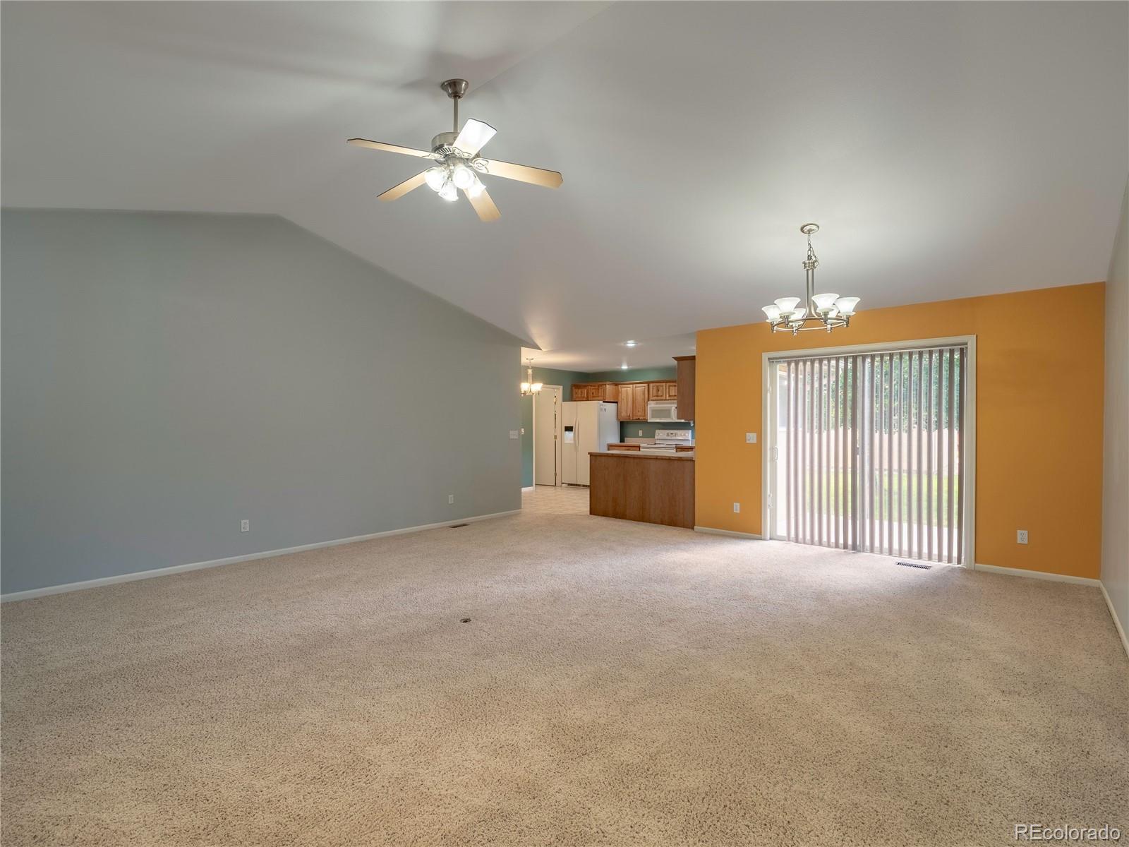 1436 H Street, Unit D Salida, CO 81201 - Photo 7 of 31 a view of a livingroom with a chandelier fan and windows